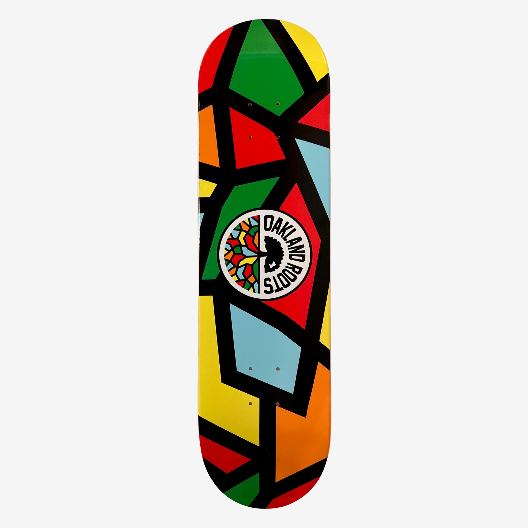 Oakland Roots mosaic print skateboard deck and Oakland roots logo crest.