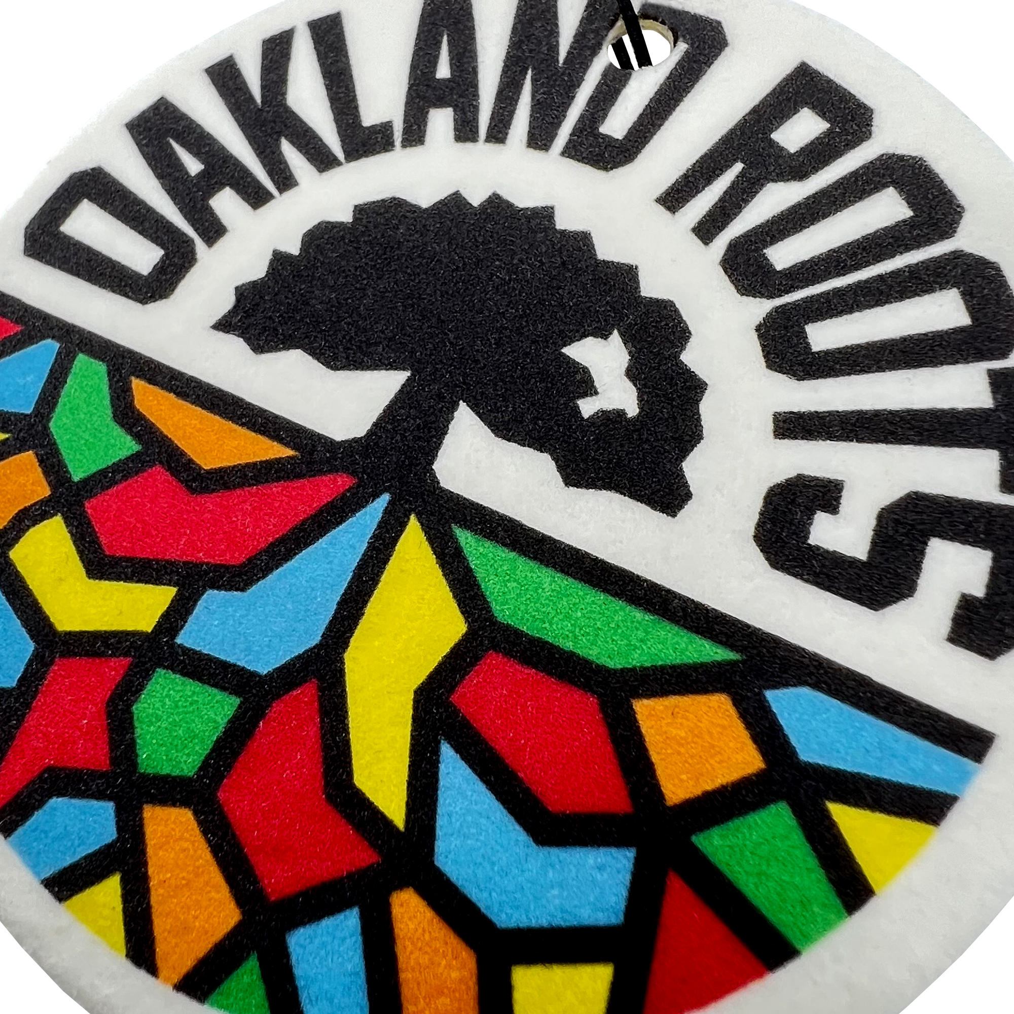 Close up of Oakland Roots SC logo air freshener.