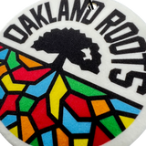 Close up of Oakland Roots SC logo air freshener.